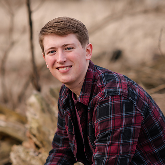 Young man red black blue plaid shirt